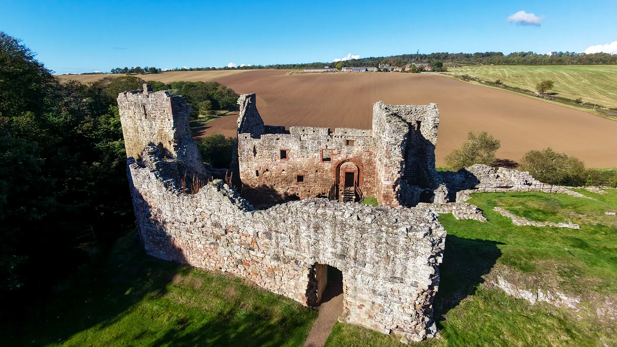 Hailes Castle and fields from a drone