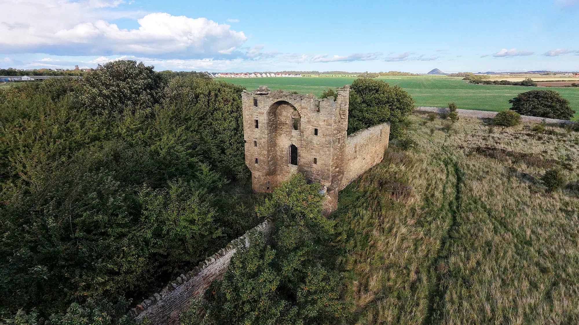 Saltcoats Castle among fields from a drone